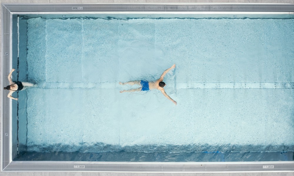 Couple in the pool - drone shot