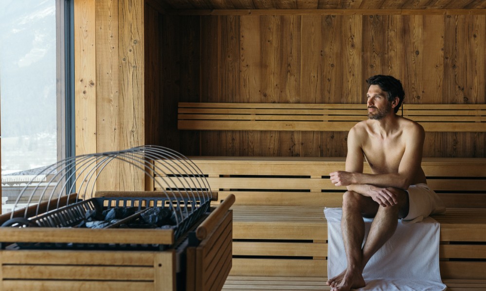 man relaxing in a sauna